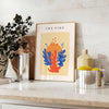 Abstract design featuring layered orange and blue paper-cut shapes - styled on a counter with eucalyptus and a bowl of lemons