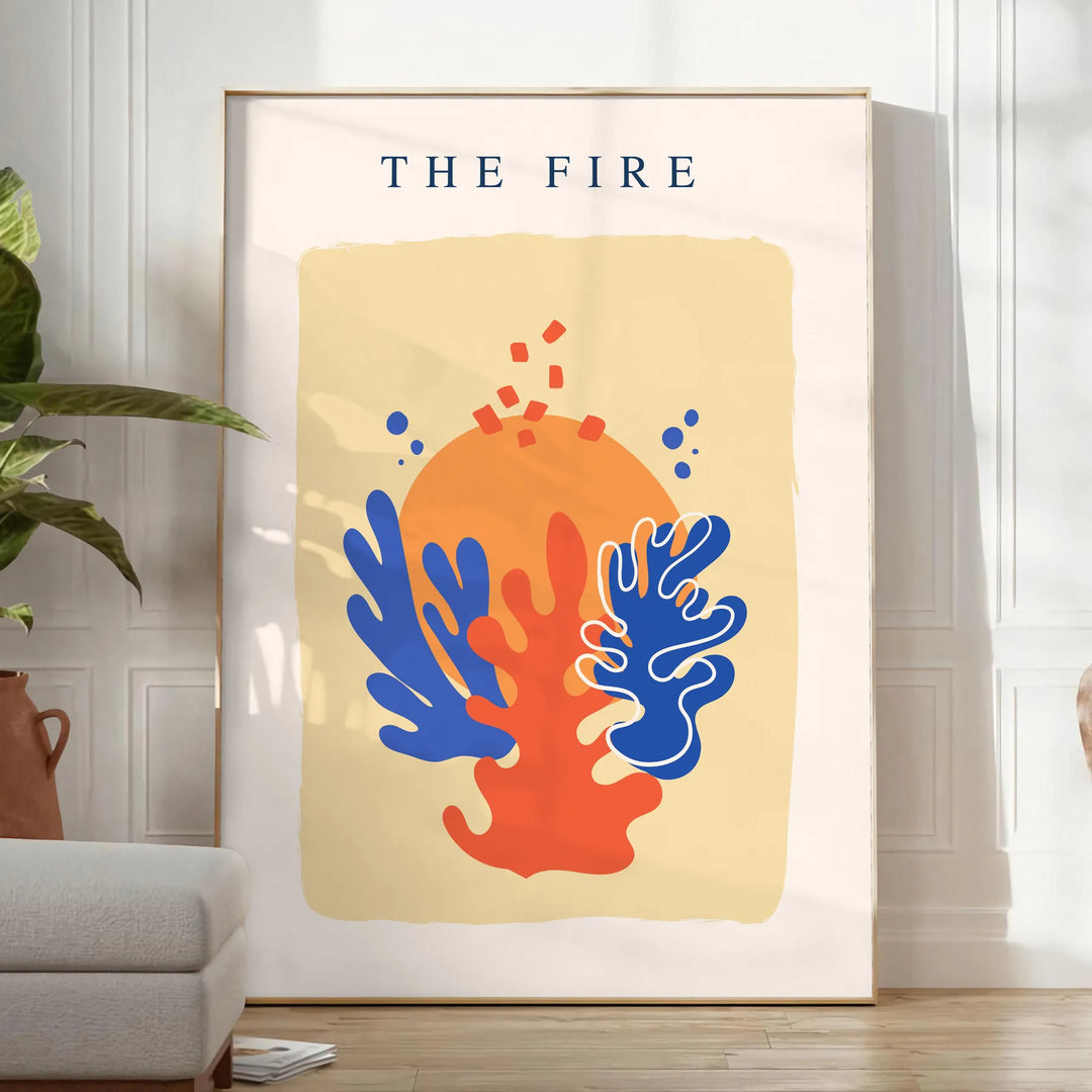 Abstract design featuring layered orange and blue paper-cut shapes - in a bright minimalist room with a plant and an armchair