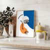 Brown and black paper-cut abstract poster with layered minimalist shapes - styled on a counter with eucalyptus and a bowl of lemons