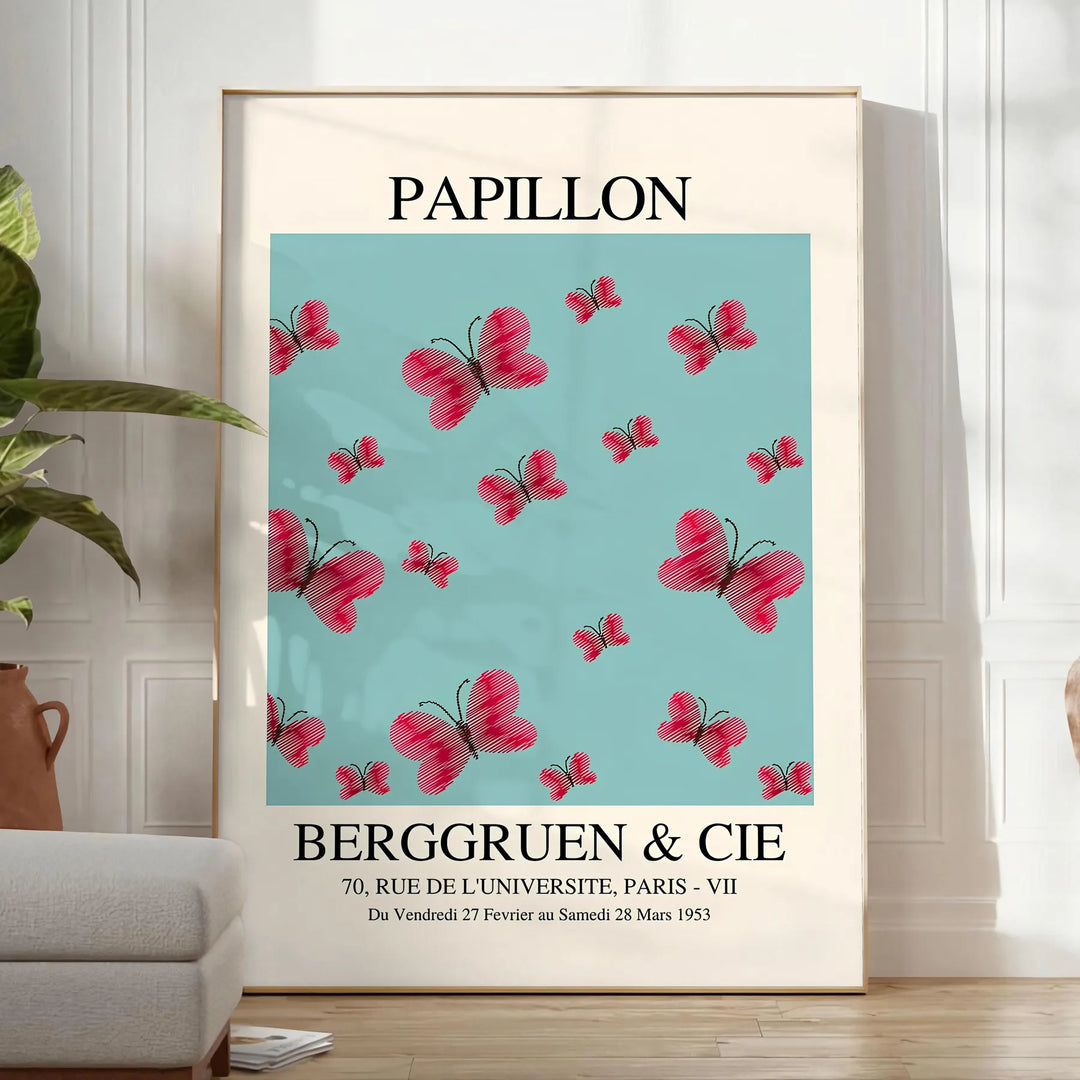 Maximalist poster featuring a colorful butterfly against a dark background - in a bright minimalist room with a plant and an armchair