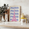 Stylized illustration of Paris with green and white tones - styled on a counter with eucalyptus and a bowl of lemons