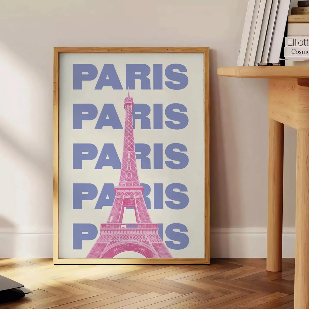 Stylized illustration of Paris with green and white tones - beside a round wooden side table with books