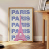 Stylized illustration of Paris with green and white tones - beside a round wooden side table with books