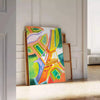 Graphic illustration of Paris with orange and blue tones - leaning on a herringbone floor against a white panelled wall