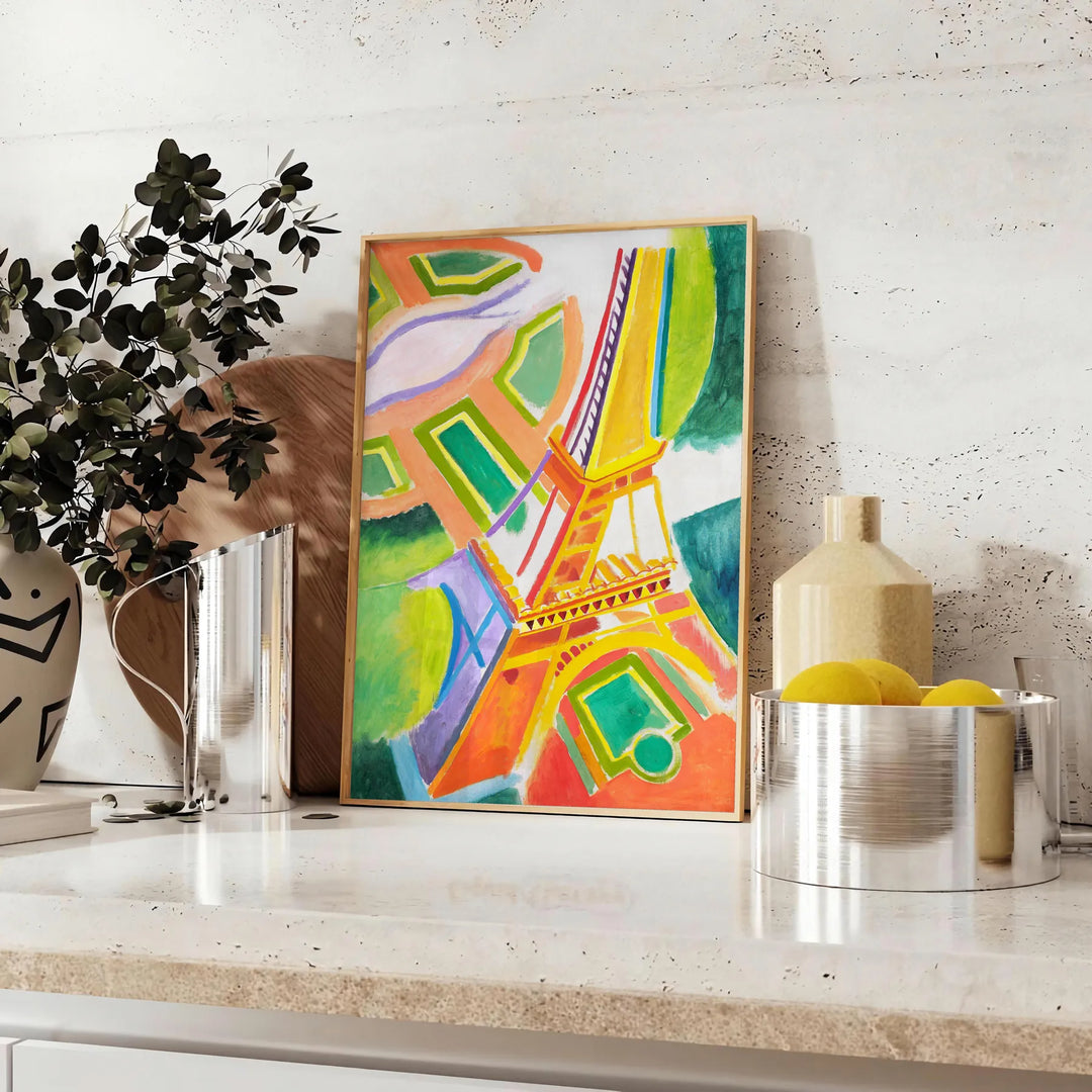 Graphic illustration of Paris with orange and blue tones - styled on a counter with eucalyptus and a bowl of lemons