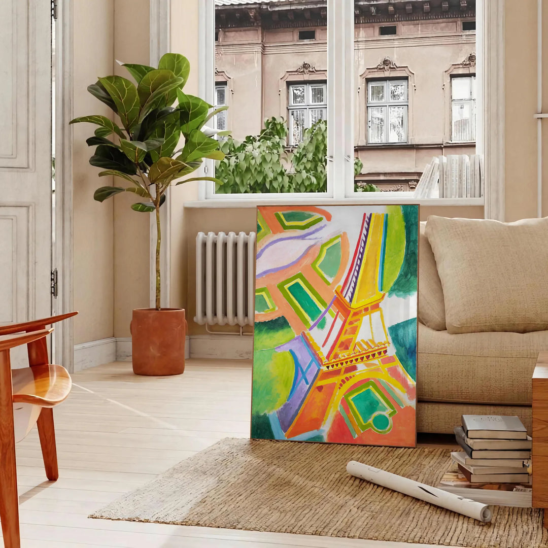 Graphic illustration of Paris with orange and blue tones - in a Parisian living room with a sofa and a fig plant