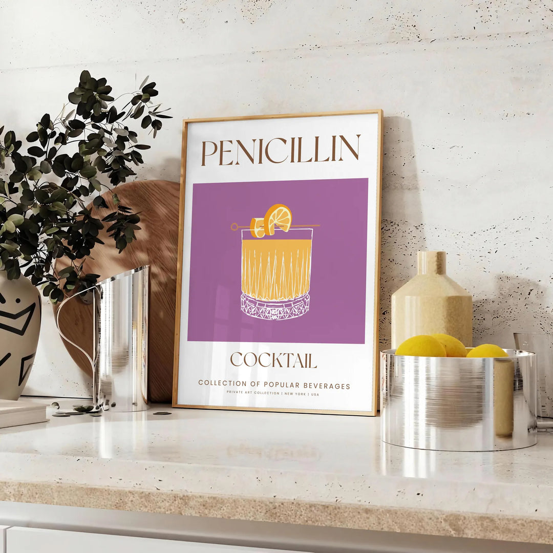 A modern illustration of a Penicillin cocktail with gray and orange tones - styled on a counter with eucalyptus and a bowl of lemons