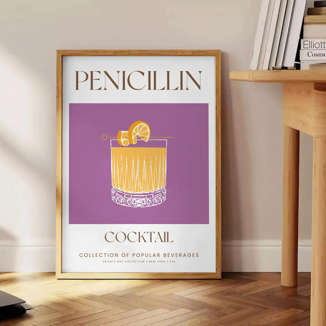 A modern illustration of a Penicillin cocktail with gray and orange tones - beside a round wooden side table with books
