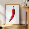 Ein farbenfrohes Küchenbild mit roten und grünen Paprika in modernem Stil - neben einem runden Beistelltisch aus Holz mit Büchern