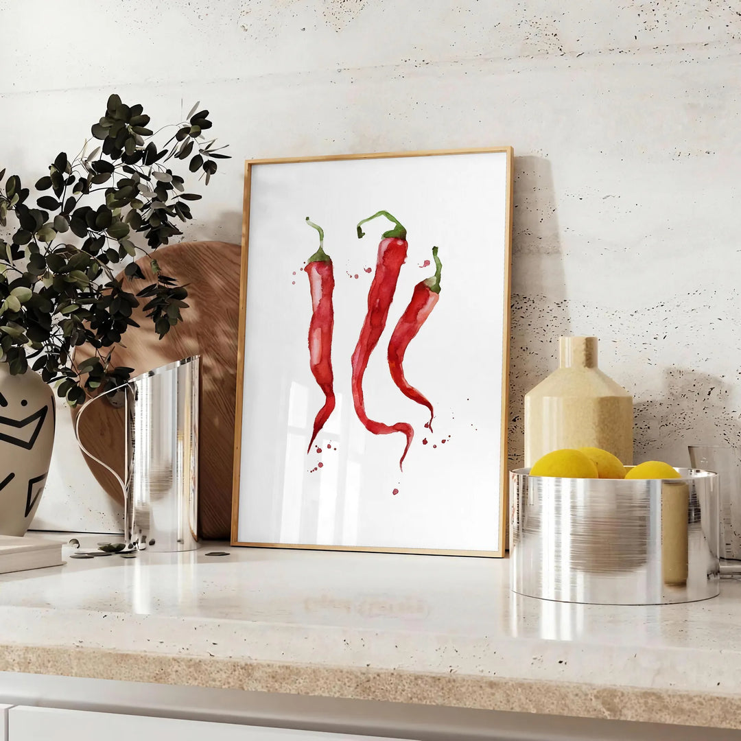 A colorful pepper illustration with rich brown and green tones - styled on a counter with eucalyptus and a bowl of lemons
