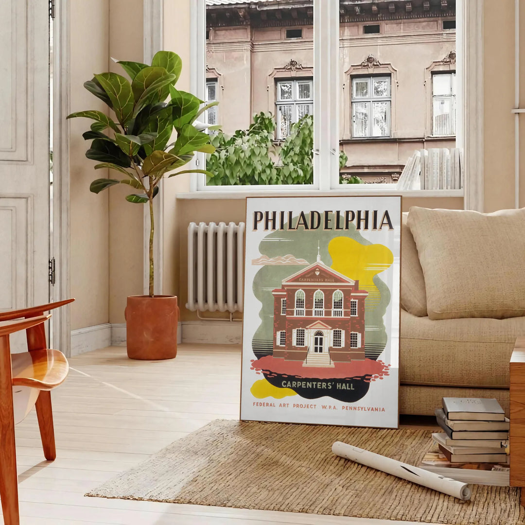 Illustration of Philadelphia skyline with green and brown tones - in a Parisian living room with a sofa and a fig plant