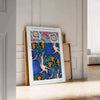 Botanical illustration featuring orange and blue plants by EA Séguy - leaning on a herringbone floor against a white panelled wall