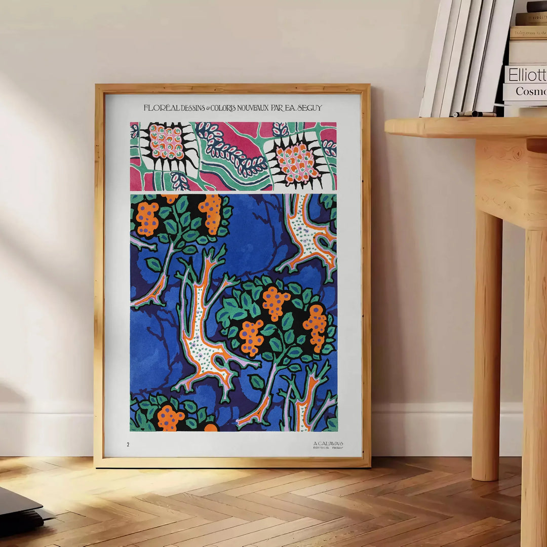 Botanical illustration featuring orange and blue plants by EA Séguy - beside a round wooden side table with books