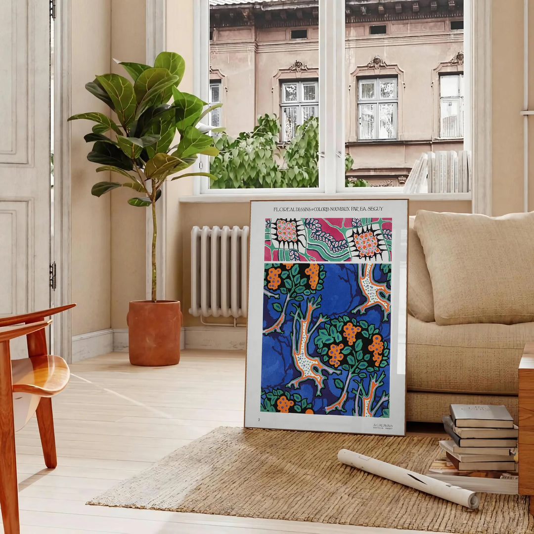 Botanical illustration featuring orange and blue plants by EA Séguy - in a Parisian living room with a sofa and a fig plant