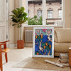Botanical illustration featuring orange and blue plants by EA Séguy - in a Parisian living room with a sofa and a fig plant