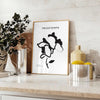 Botanical illustration featuring graceful plant designs in gray and black tones - styled on a counter with eucalyptus and a bowl of lemons
