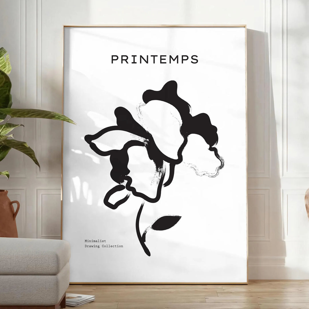 Botanical illustration featuring graceful plant designs in gray and black tones - in a bright minimalist room with a plant and an armchair