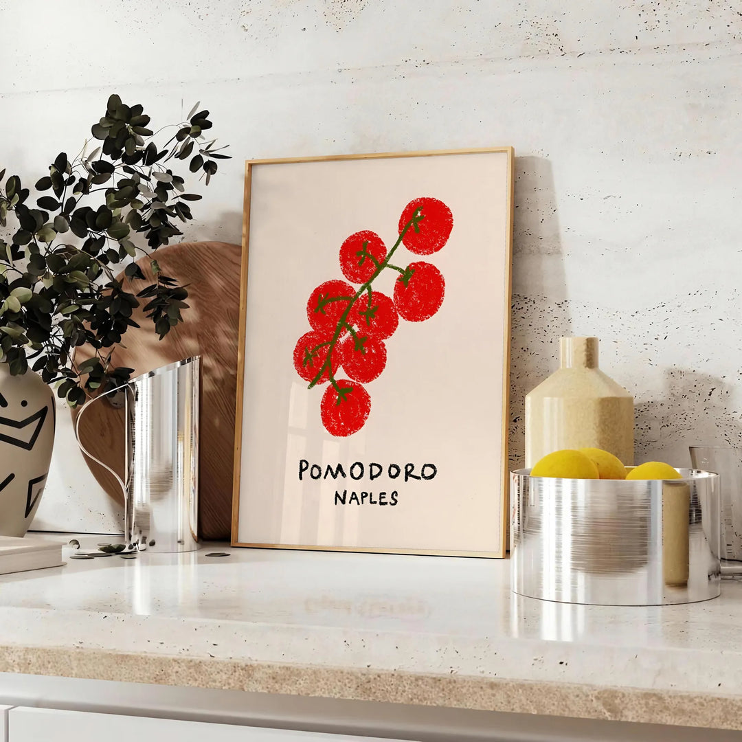 A colorful illustration of tomatoes and kitchen utensils inspired by Naples, Italy - styled on a counter with eucalyptus and a bowl of lemons