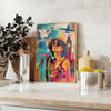 Bold pop art design featuring orange and blue colors with abstract shapes - styled on a counter with eucalyptus and a bowl of lemons