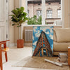 Colorful pop art design featuring abstract shapes and modern elements - in a Parisian living room with a sofa and a fig plant
