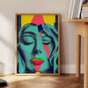 Colorful pop art depiction of a woman with orange and green tones - beside a round wooden side table with books