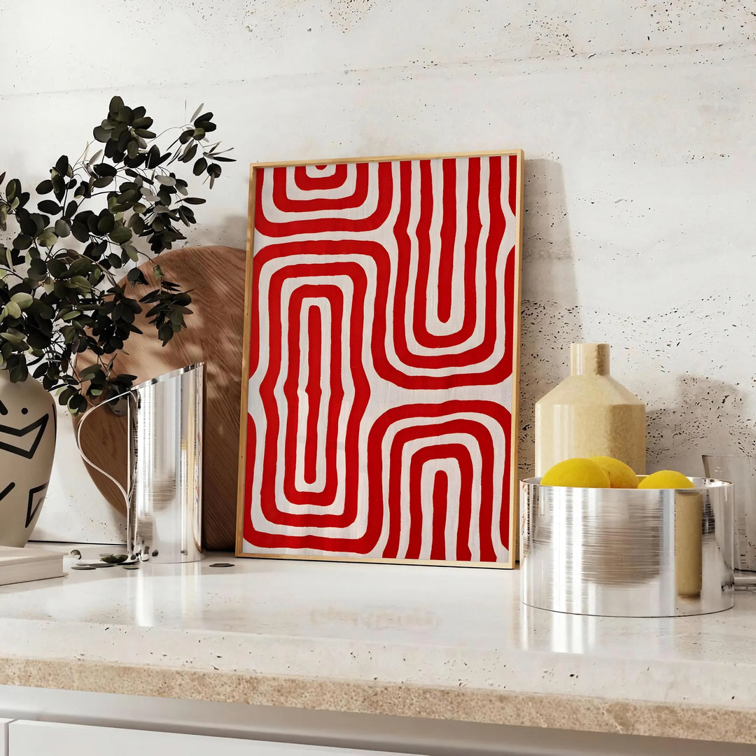Abstract space scene with bold orange and red tones - styled on a counter with eucalyptus and a bowl of lemons