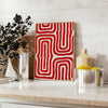 Abstract space scene with bold orange and red tones - styled on a counter with eucalyptus and a bowl of lemons