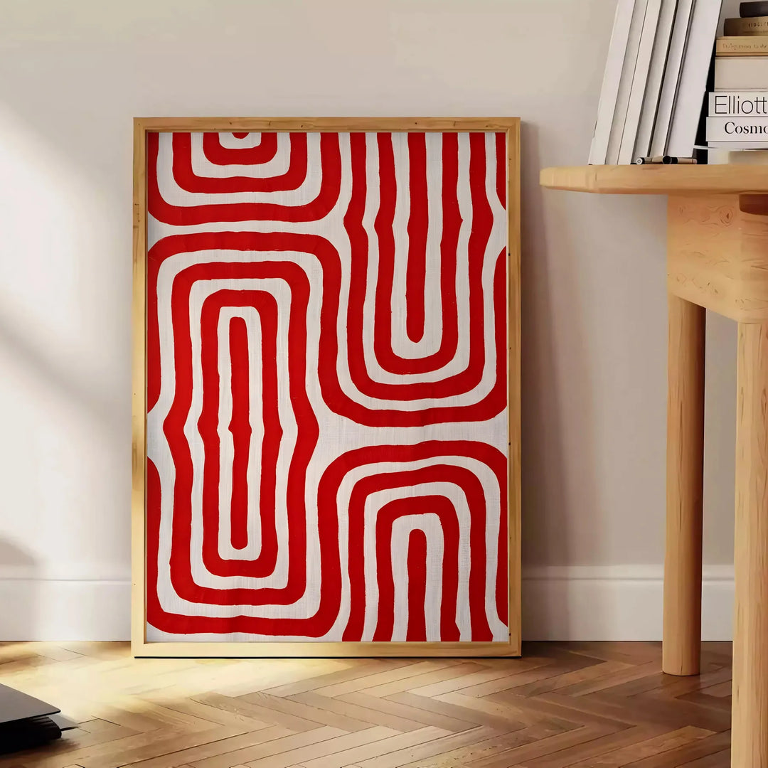 Abstract space scene with bold orange and red tones - beside a round wooden side table with books