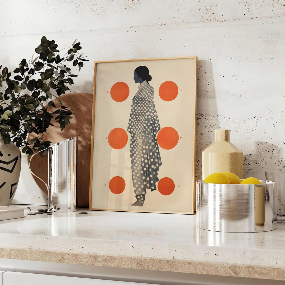 Stylish gray poster with vibrant orange abstract shapes - styled on a counter with eucalyptus and a bowl of lemons