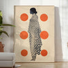 Stylish gray poster with vibrant orange abstract shapes - in a bright minimalist room with a plant and an armchair