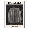 A bright orange pumpkin covered in black polka dots by Yayoi Kusama - in a black frame