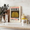 Yellow and orange pumpkin with polka dots by Yayoi Kusama - styled on a counter with eucalyptus and a bowl of lemons
