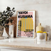 A pumpkin pattern in Yayoi Kusama's signature polka dot style with yellow and black colors - styled on a counter with eucalyptus and a bowl of lemons