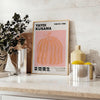A pumpkin pattern in Yayoi Kusama's signature polka dot style with black and brown tones - styled on a counter with eucalyptus and a bowl of lemons