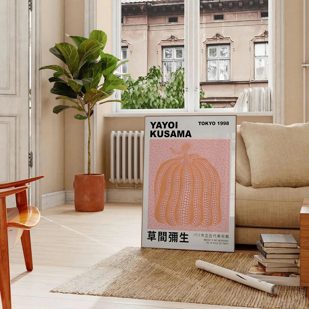 A pumpkin pattern in Yayoi Kusama's signature polka dot style with black and brown tones - in a Parisian living room with a sofa and a fig plant