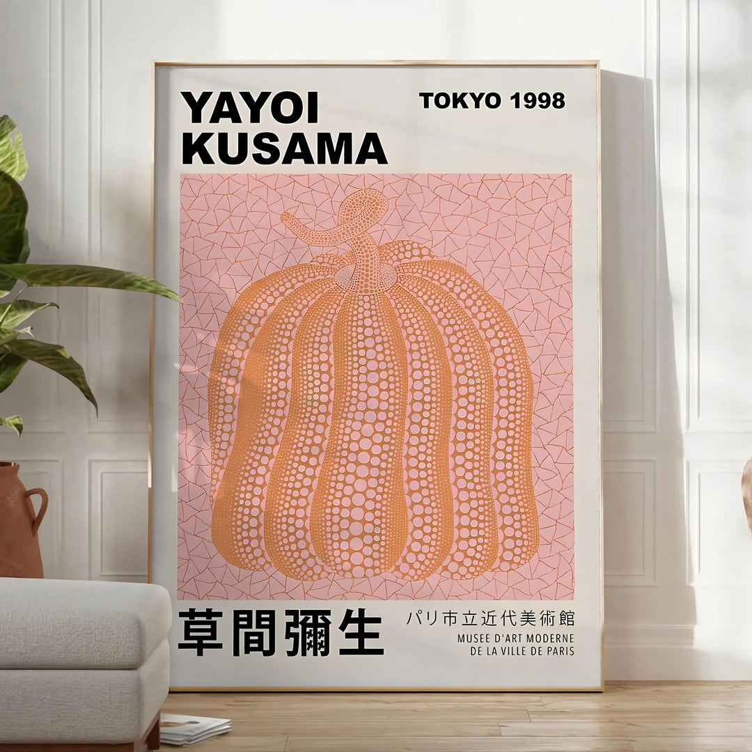 A pumpkin pattern in Yayoi Kusama's signature polka dot style with black and brown tones - in a bright minimalist room with a plant and an armchair