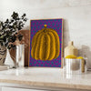 Colorful pumpkin pattern with polka dots by Yayoi Kusama - styled on a counter with eucalyptus and a bowl of lemons