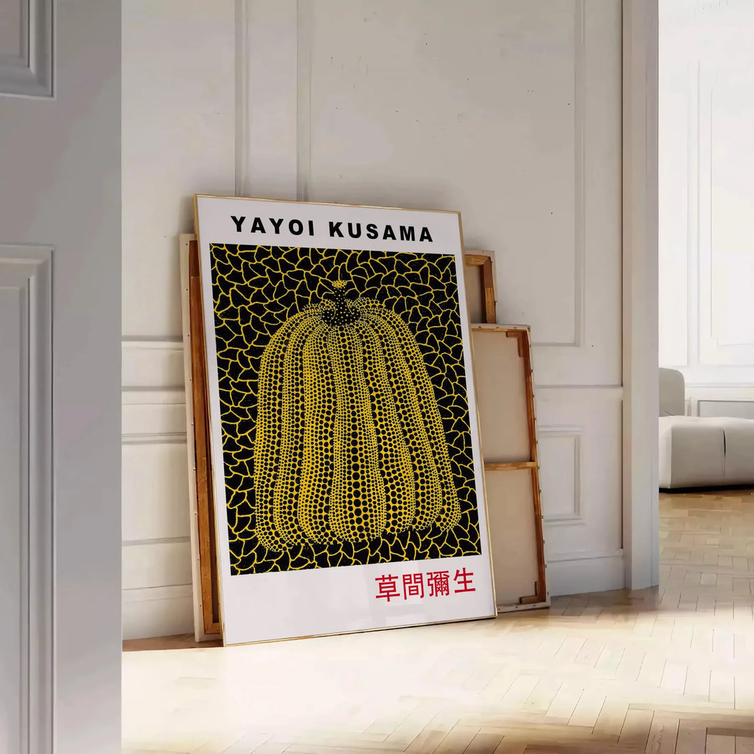 Yellow pumpkin with black polka dots in Yayoi Kusama's signature style - leaning on a herringbone floor against a white panelled wall