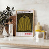 Yellow pumpkin with black polka dots in Yayoi Kusama's signature style - styled on a counter with eucalyptus and a bowl of lemons