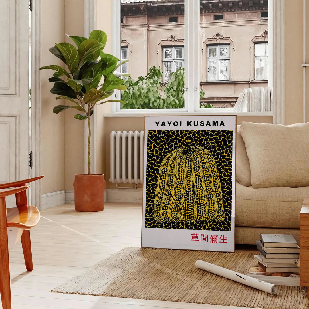 Yellow pumpkin with black polka dots in Yayoi Kusama's signature style - in a Parisian living room with a sofa and a fig plant