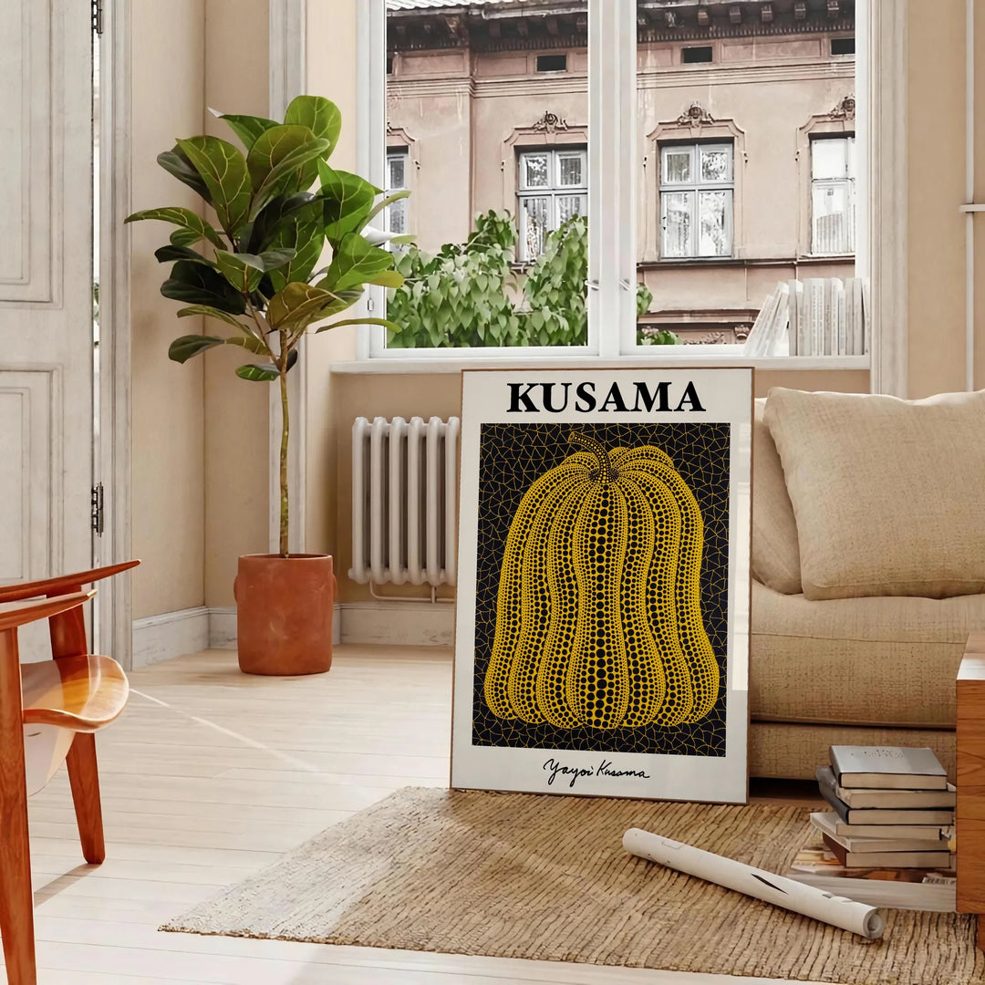 A pumpkin with polka dots in Yayoi Kusama's signature style, orange and black colors - in a Parisian living room with a sofa and a fig plant