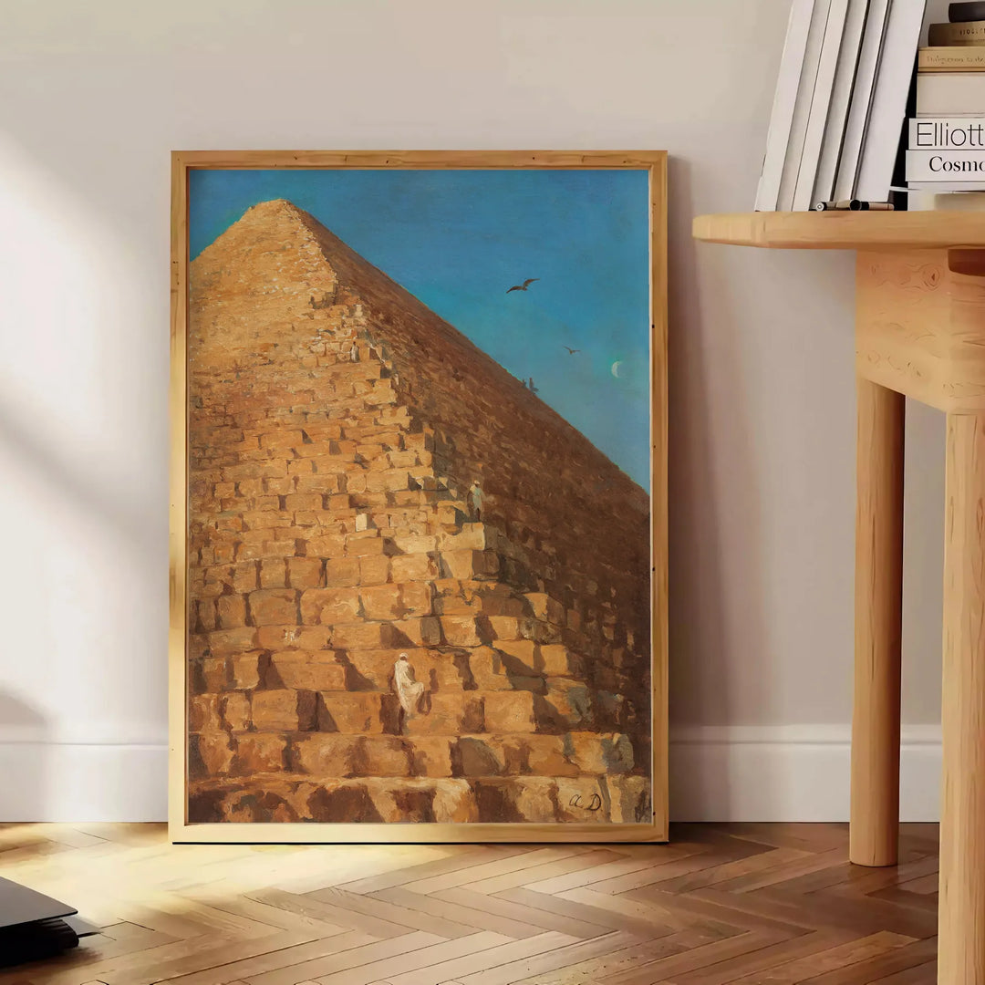 Vintage artwork featuring a pyramid with green and orange hues - beside a round wooden side table with books