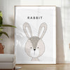 A rabbit in a serene gray and black color palette - in a bright minimalist room with a plant and an armchair