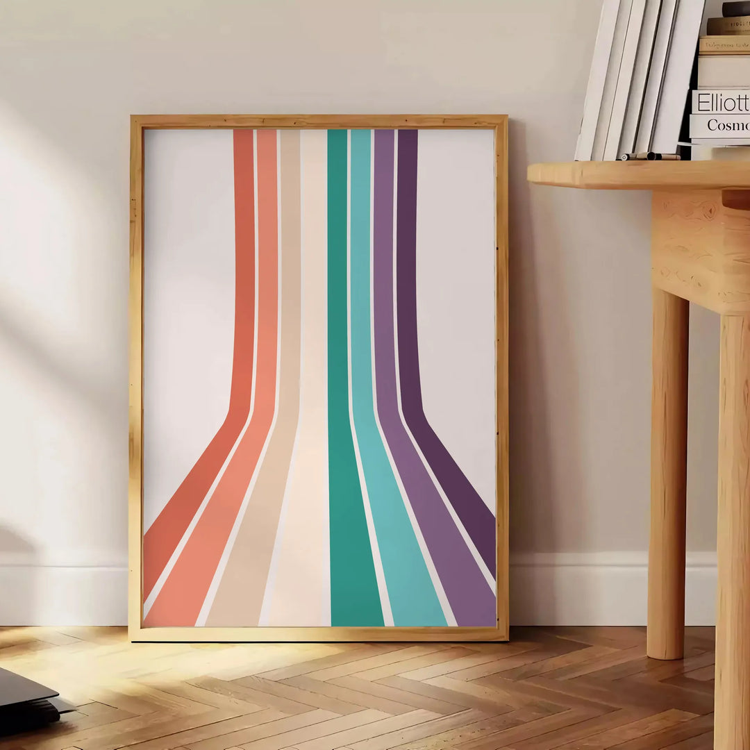 Design abstrato colorido apresentando um espectro de arco-íris em fundo cinza - ao lado de uma mesa de apoio redonda em madeira com livros
