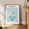 art culinaire affiche vibrante nuances vert bleu idéal cuisine cadeau formats A4 cm A0 - à côté d'une table d'appoint ronde en bois avec des livres