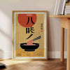 Illustration of a ramen kitchen with bold yellow and black colors - beside a round wooden side table with books