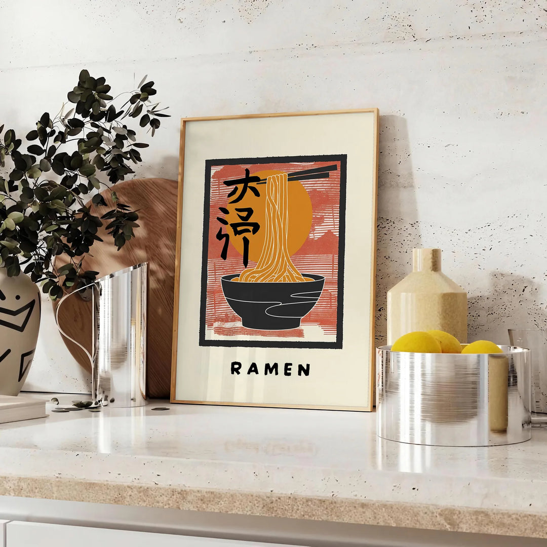 Illustration of a ramen kitchen with bold black and orange colors - styled on a counter with eucalyptus and a bowl of lemons