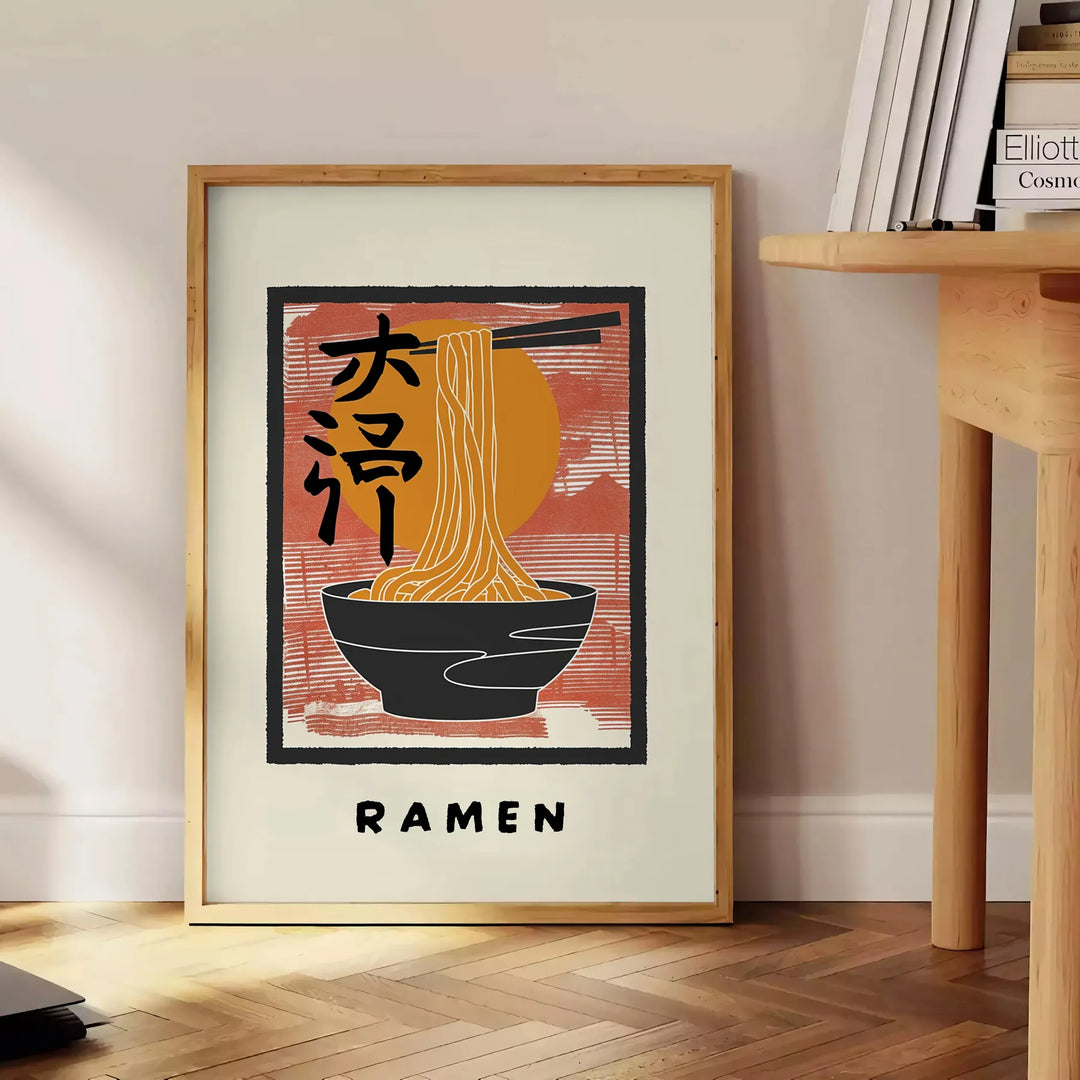 Illustration of a ramen kitchen with bold black and orange colors - beside a round wooden side table with books