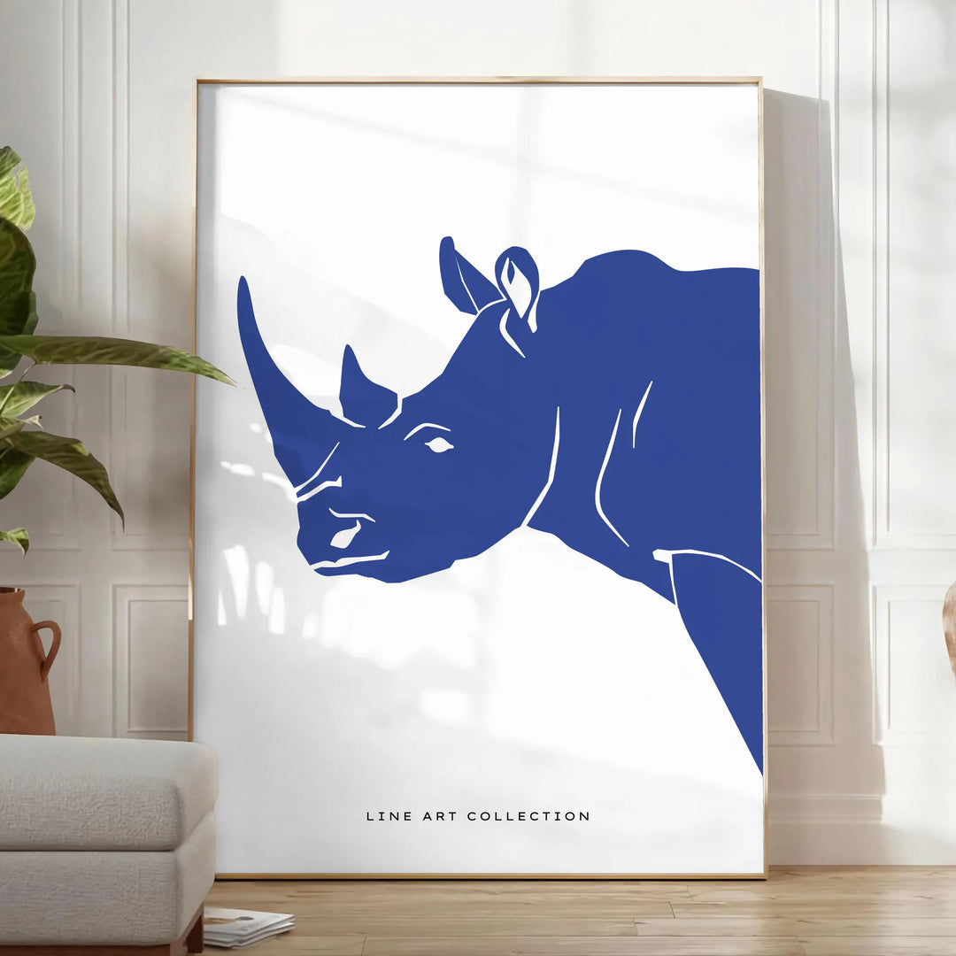 A rhinoceros standing in a natural habitat with blue and black tones - in a bright minimalist room with a plant and an armchair