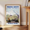 Travel poster featuring San Francisco and Portland with gray and green tones - beside a round wooden side table with books
